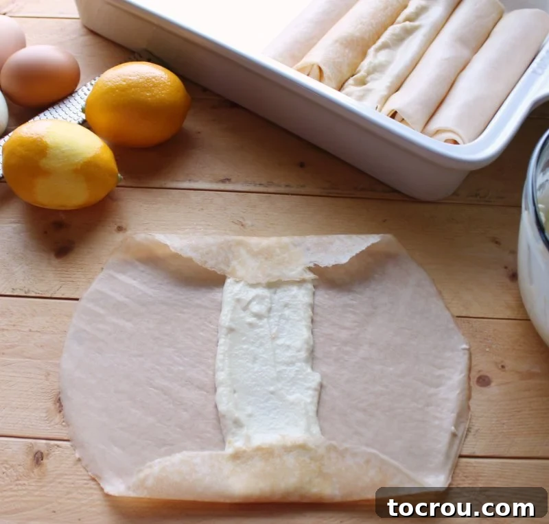 folding ends of crepe over filling, ready to roll.