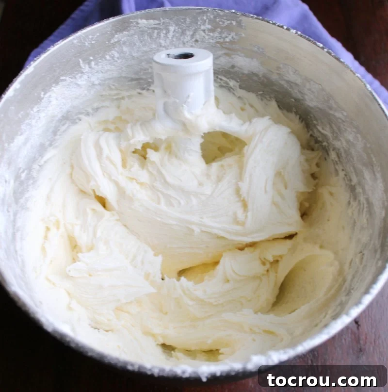 mixing bowl full of white marshmallow buttercream frosting