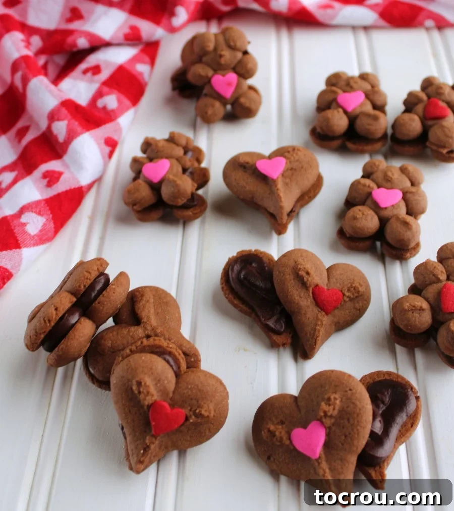 An array of beautifully assembled teddy bear and heart-shaped chocolate sandwich cookies, showcasing the delightful ganache filling.