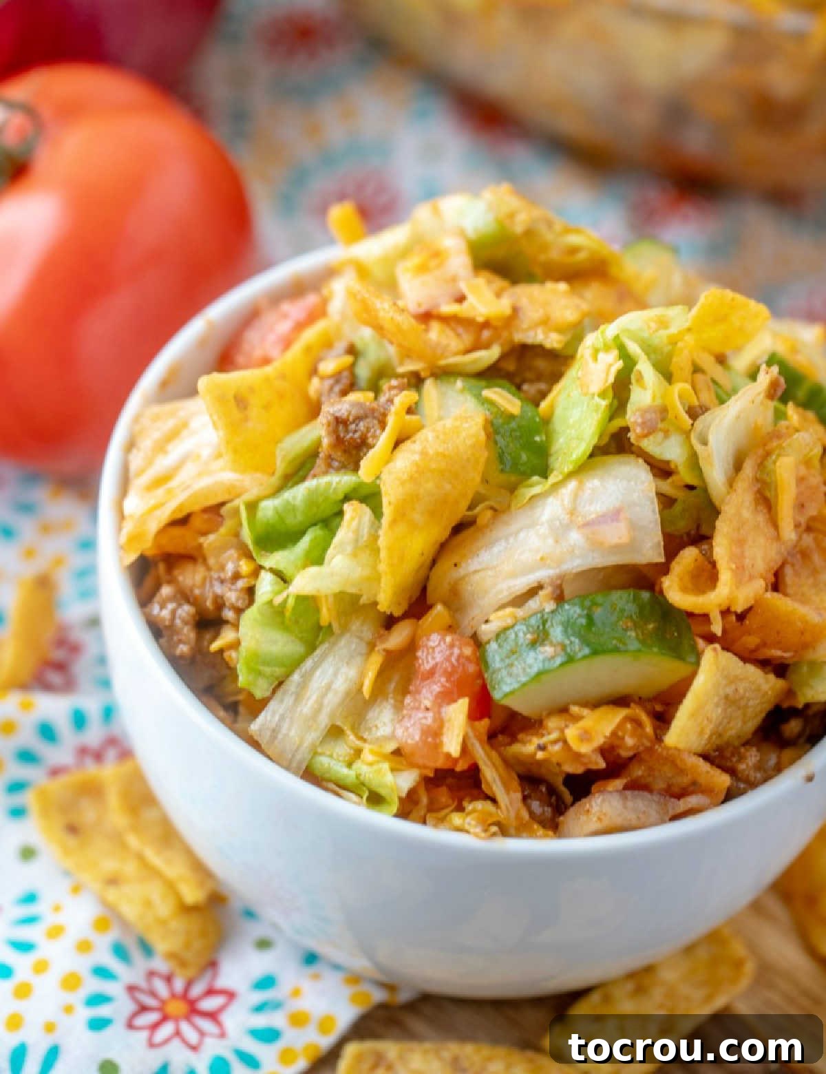 Frito Taco Salad: Delicious and ready to eat. A bird's eye view of a bowl of Frito Taco Salad, perfectly served and ready to be enjoyed.
