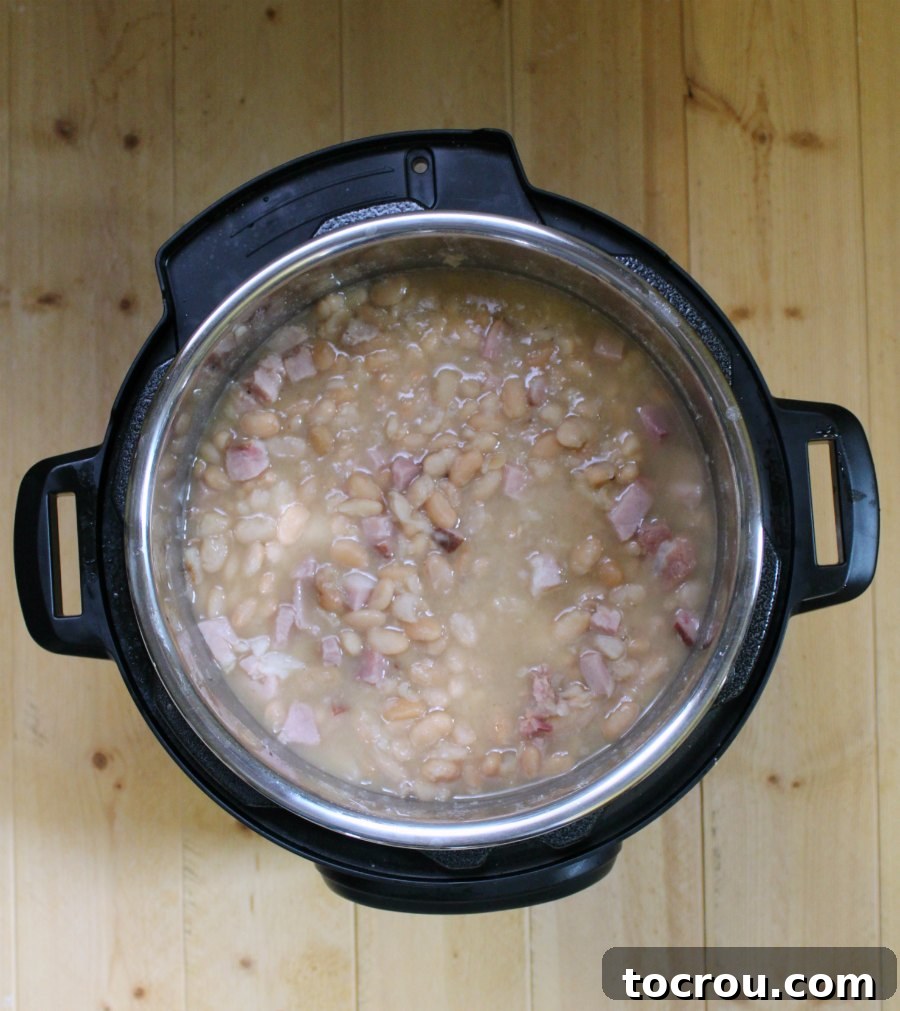 cooked ham and beans in instant pot, ready to serve.