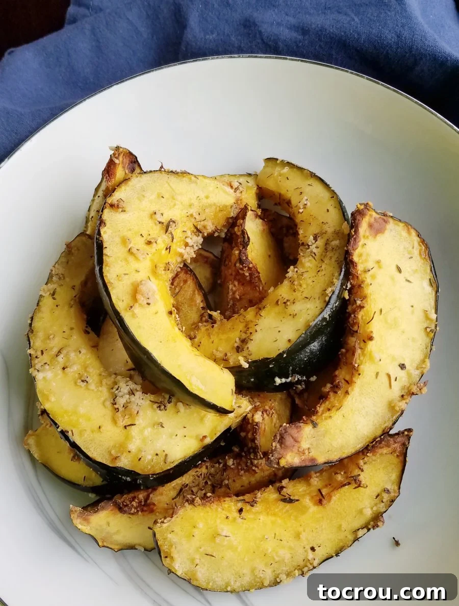 Crispy Parmesan Air-Fried Acorn Squash 6 Pile of Parmesan roasted acorn squash ready to eat.