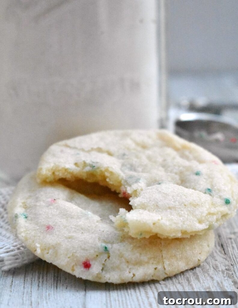 Freshly Baked Sugar Cookies Couple of sprinkle sugar cookies, one with a bite taken out.