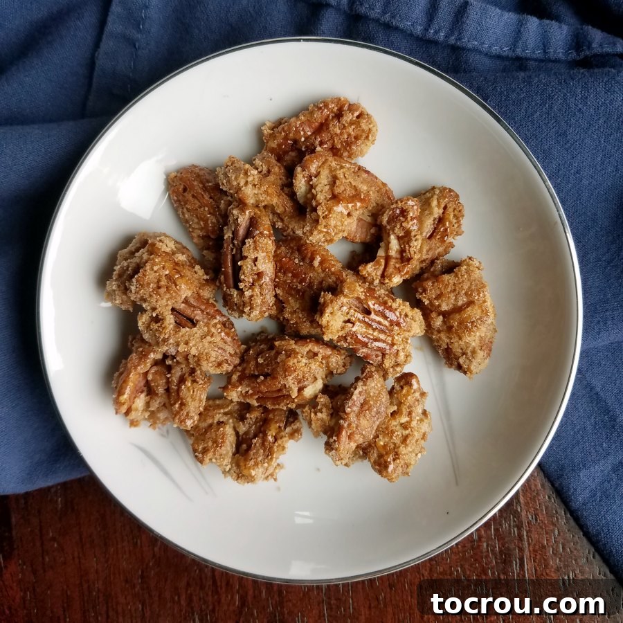 bowl of pecans with crunchy caramel coating.
