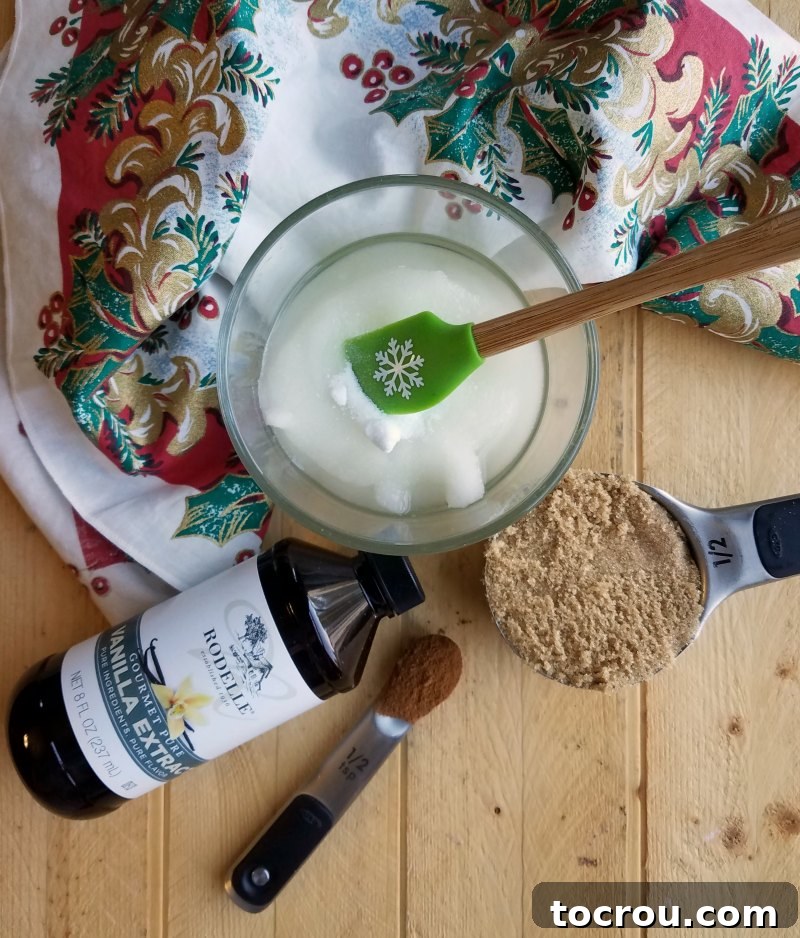 sugar, brown sugar, coconut oil, cinnamon and vanilla ready to be made into sugar scrub.