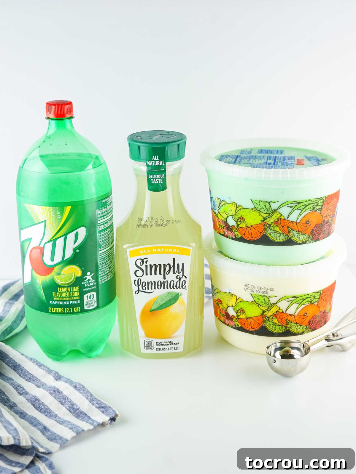 Ingredients including bottle of 7up, lemonade, lime sherbet, and lemon sherbet. 