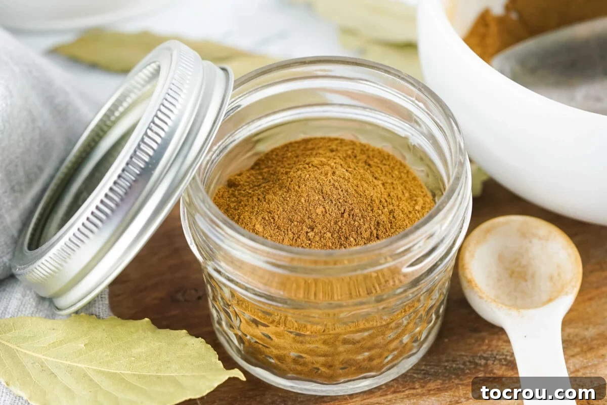Small glass jar of homemade pumpkin pie spice, ready to be stored for use later. 