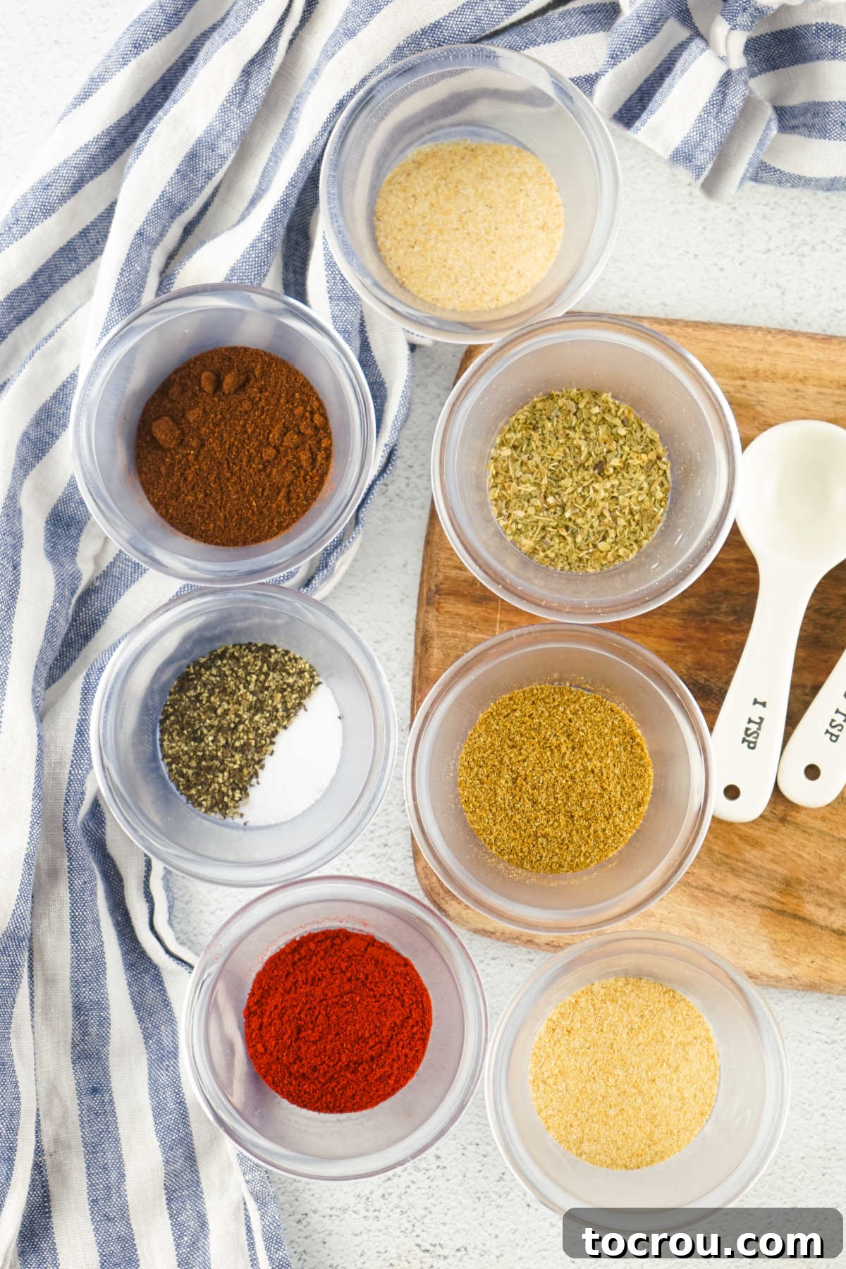 Taco Seasoning Ingredients Ingredients including garlic powder, onion powder, chili powder, cumin, oregano, salt, pepper, and paprika ready to be made into taco seasoning.