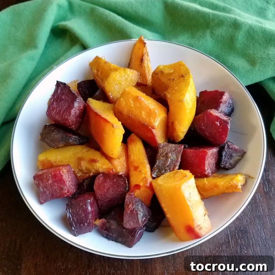 Bowl of Chinese five spice roasted carrots, beets, and squash, vibrant and ready to serve.