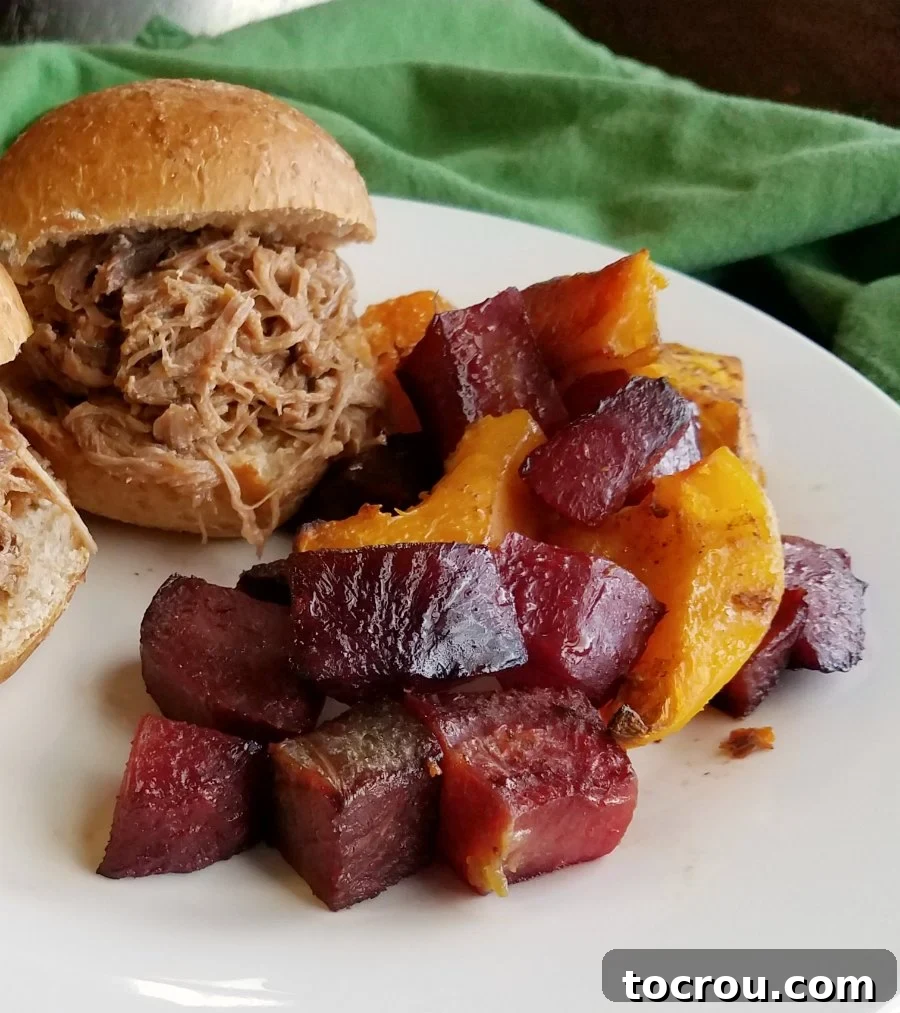 Chinese five spice roasted veggies on a plate with Hula pork sliders, a complete and inviting meal.