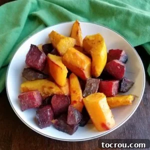 bowl of chinese 5 spice roasted carrots, beets and squash.
