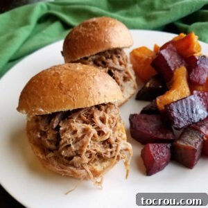 Hula Pork Sliders served on a plate with five-spice roasted vegetables, highlighting the main dish.