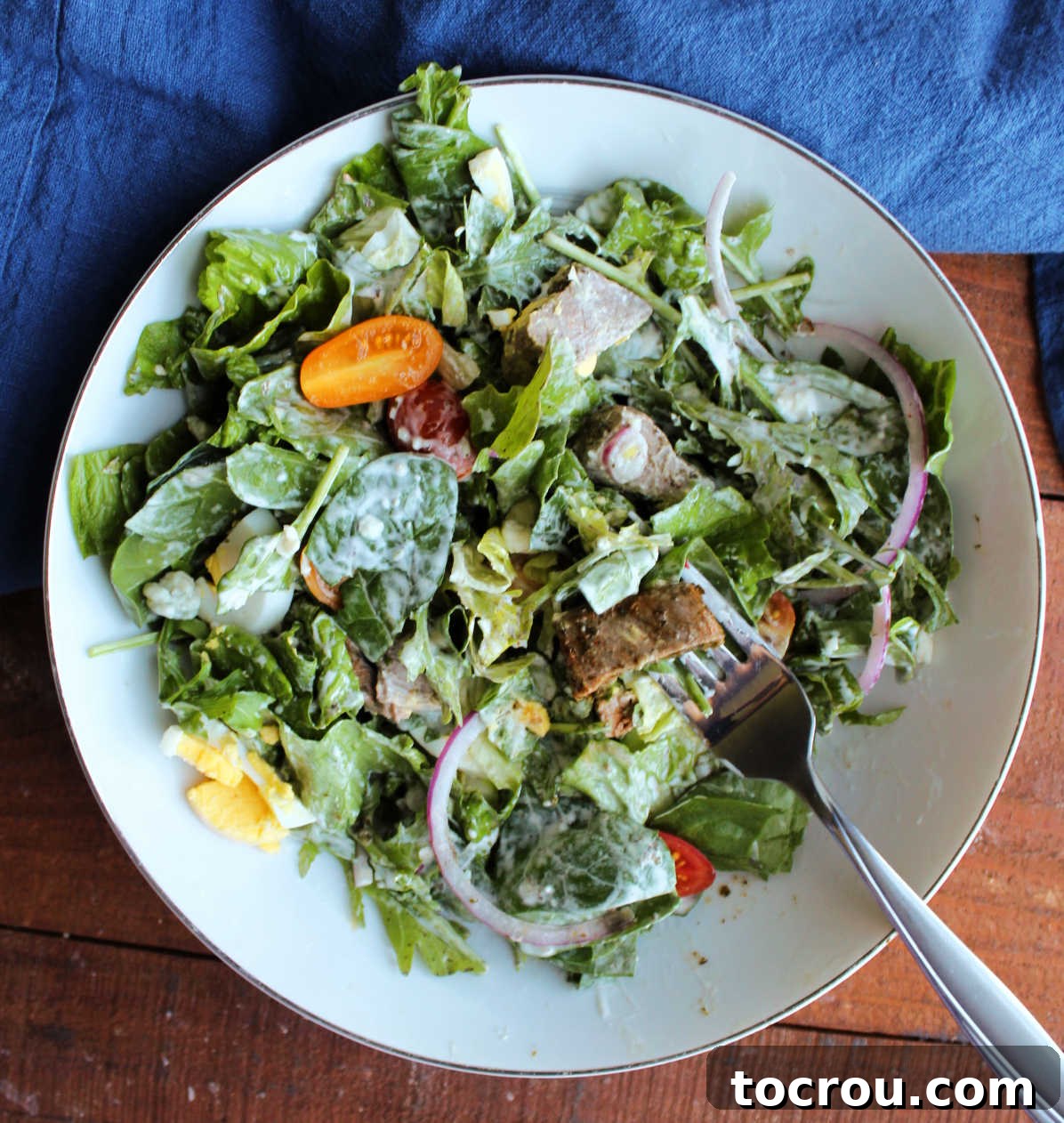 Fiercely Seared Rare Steak Salad 6 Steak salad after it has been cut and tossed, everything coated in creamy dressing, ready to eat.