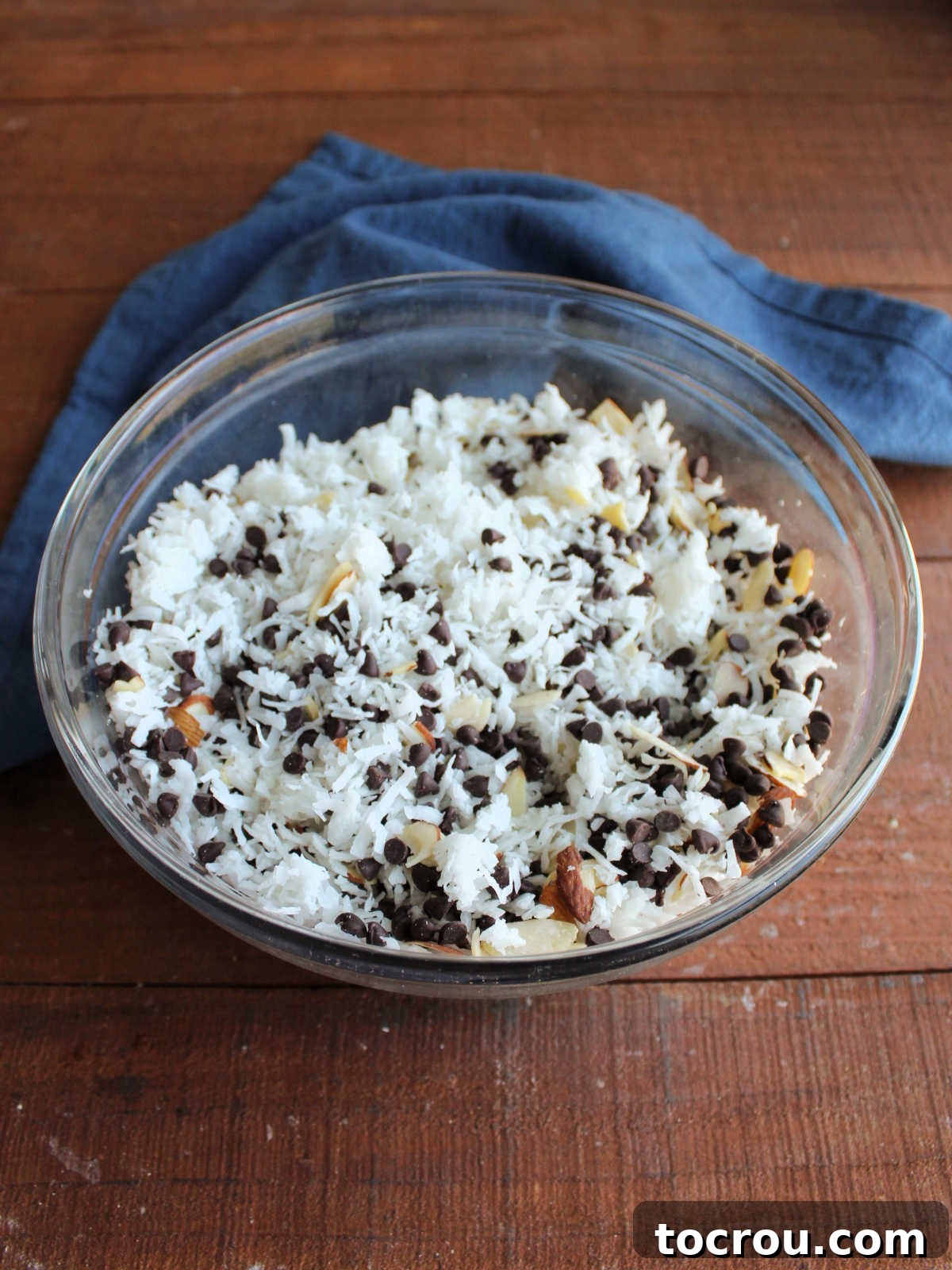 Maw-Maw's Delightful Almond Joy Macaroons 5 Bowl of shredded coconut, sliced almonds, and chocolate chips stirred together.