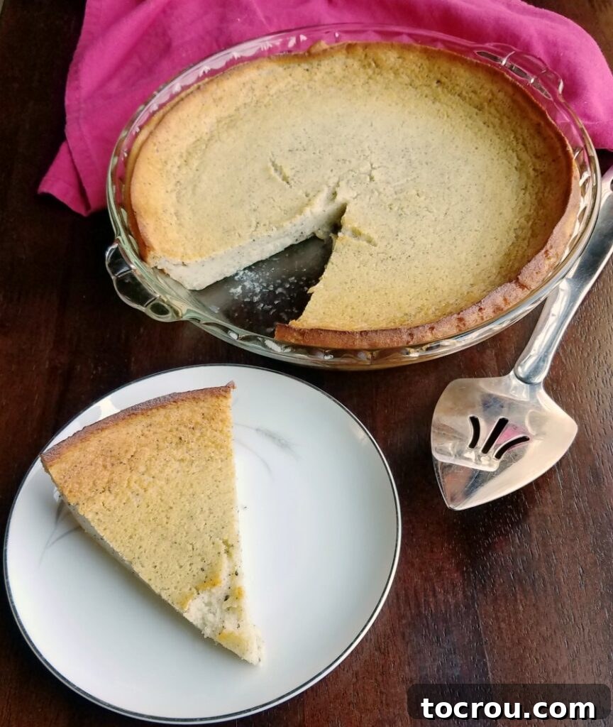 Enchanted Dragonfruit Pie 7 first slice of pie served with remaining pie nearby.