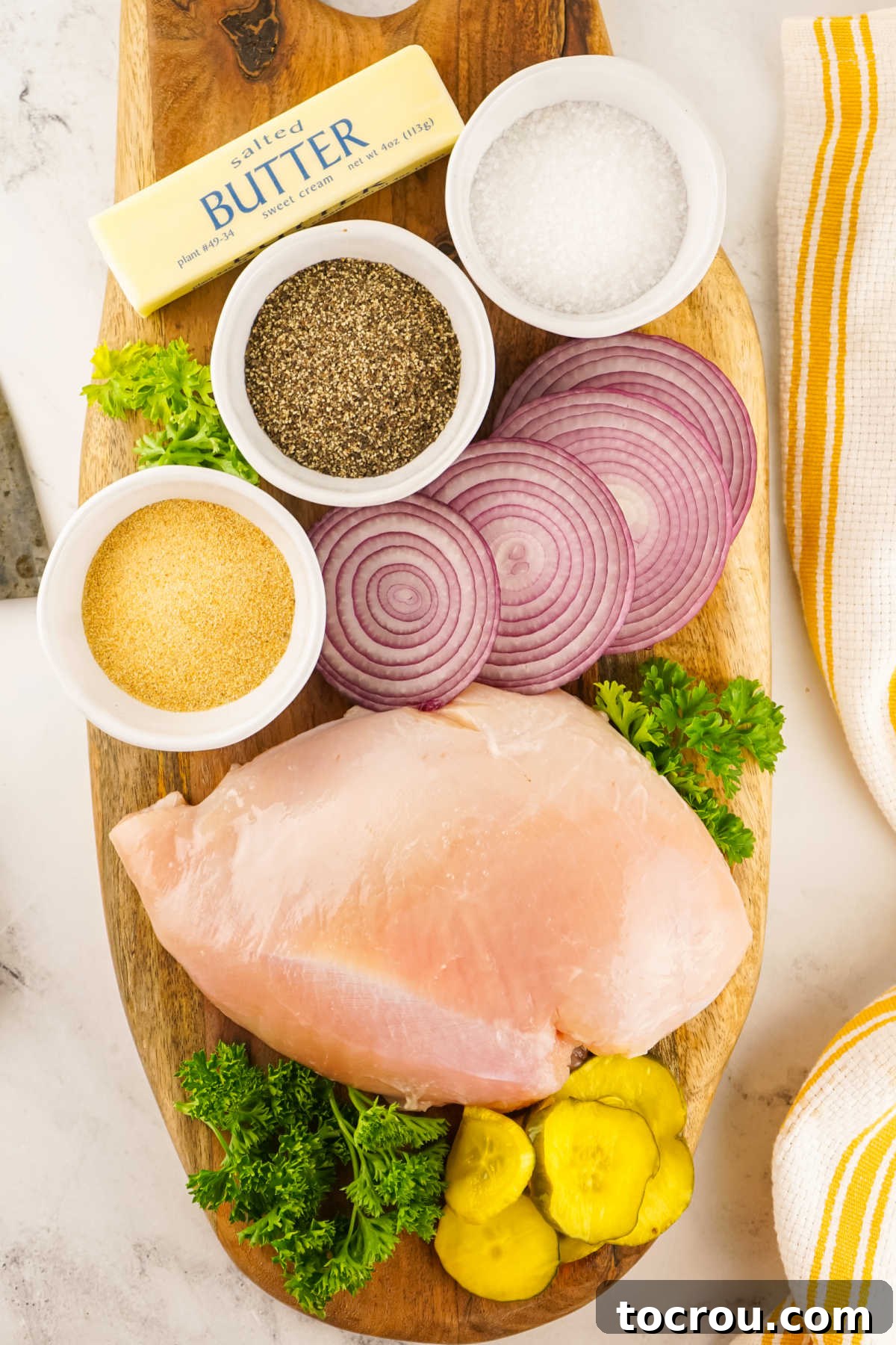 Gourmet Smoked Turkey Breast 3 Ingredients laid out: a boneless skinless turkey breast, butter, salt, black pepper, and garlic powder, ready for preparation.