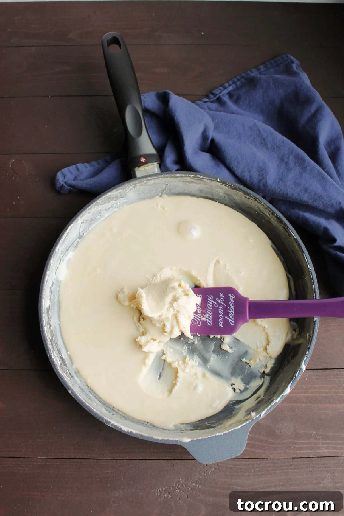 Cooled Condensed Milk Paste Thick, cooled sweetened condensed milk, sugar, and flour mixture, ready for whipping.