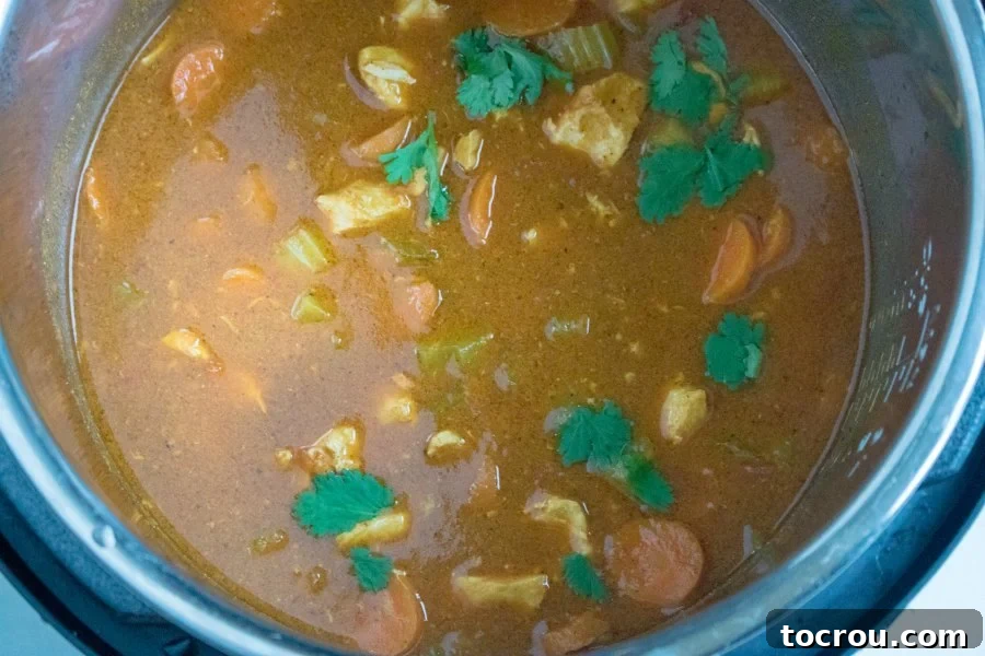 saucy curry inside electric pressure cooker.