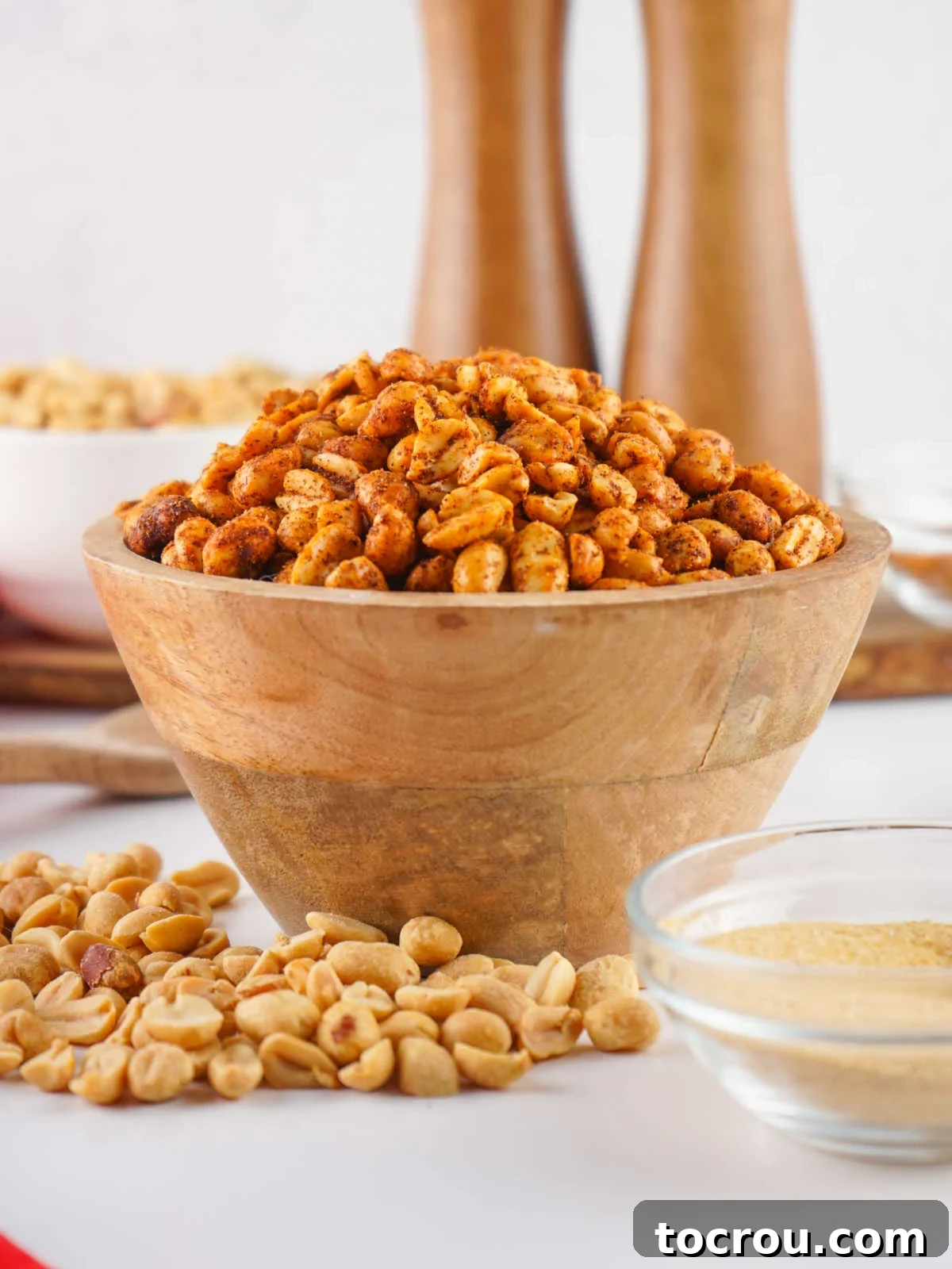 Zesty Peanuts 6 Bowl of cooled spicy peanuts, perfectly seasoned and ready to be enjoyed.