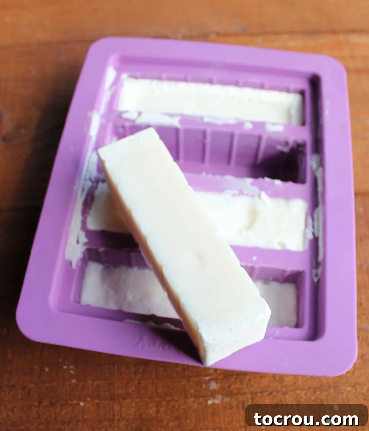 Heirloom Tea Cakes 11 A perfectly formed stick of cold lard, cleanly popped out of a silicone mold, demonstrating how easily it can be prepared for baking.