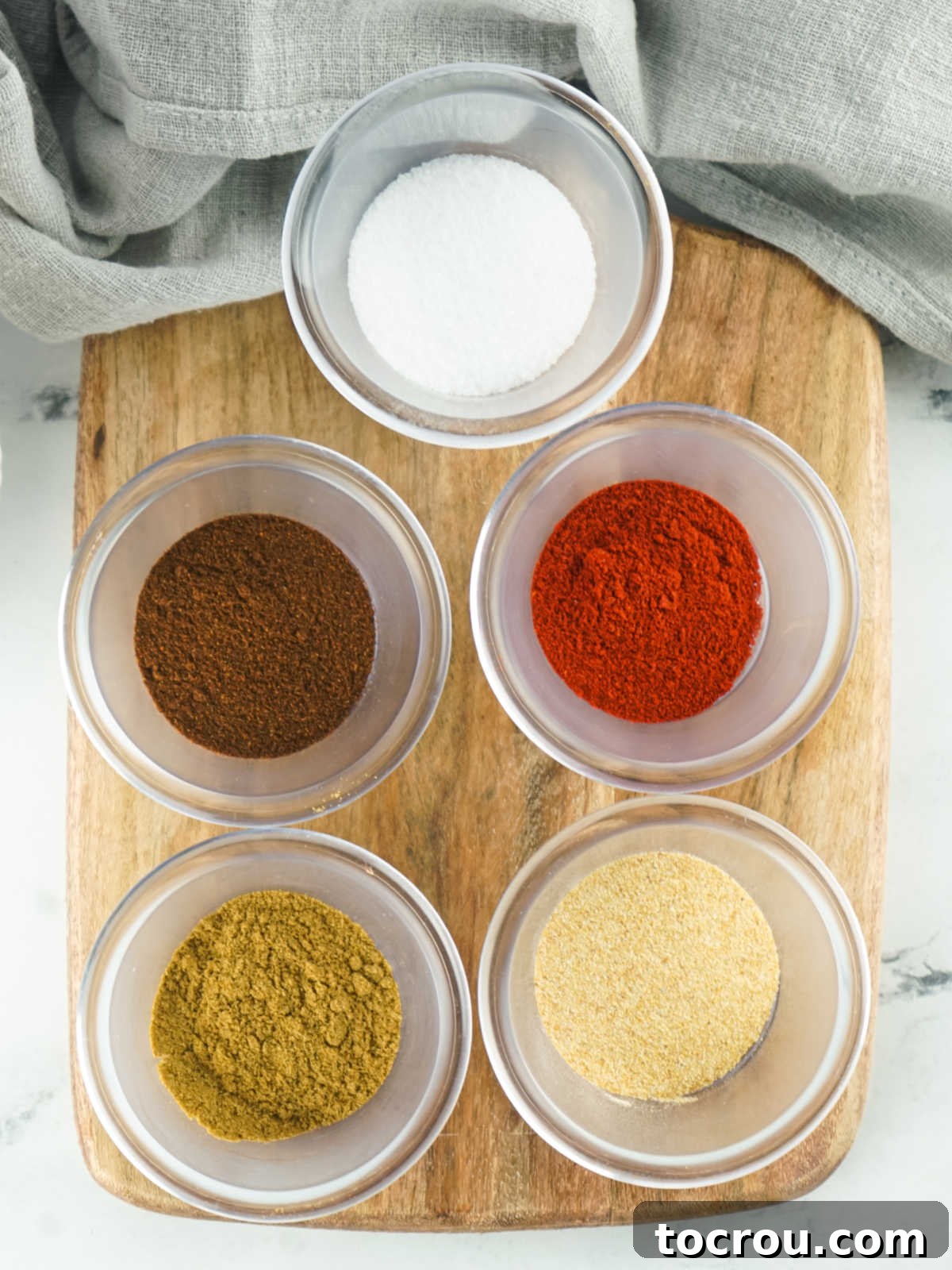 Individual Spices for Fajita Seasoning Small bowls with individual seasonings in them, ready to be mixed to make fajita seasoning.