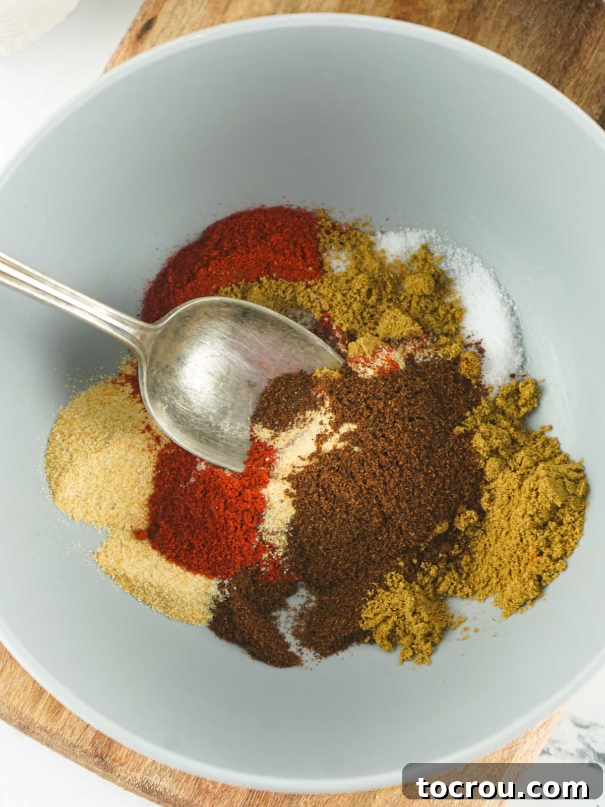 Mixing Fajita Seasoning Bowl of spices being mixed together to make fajita seasoning.