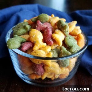 Close-up of a bowl of colorful Goldfish crackers coated in ranch seasoning, a delightful snack.