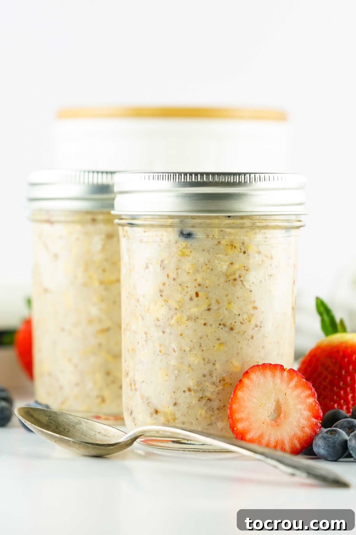 Velvety Overnight Oats 5 Jars of overnight oats after they have been refrigerated for several hours showing the liquid soaked up by the oatmeal and the texture is much thicker.