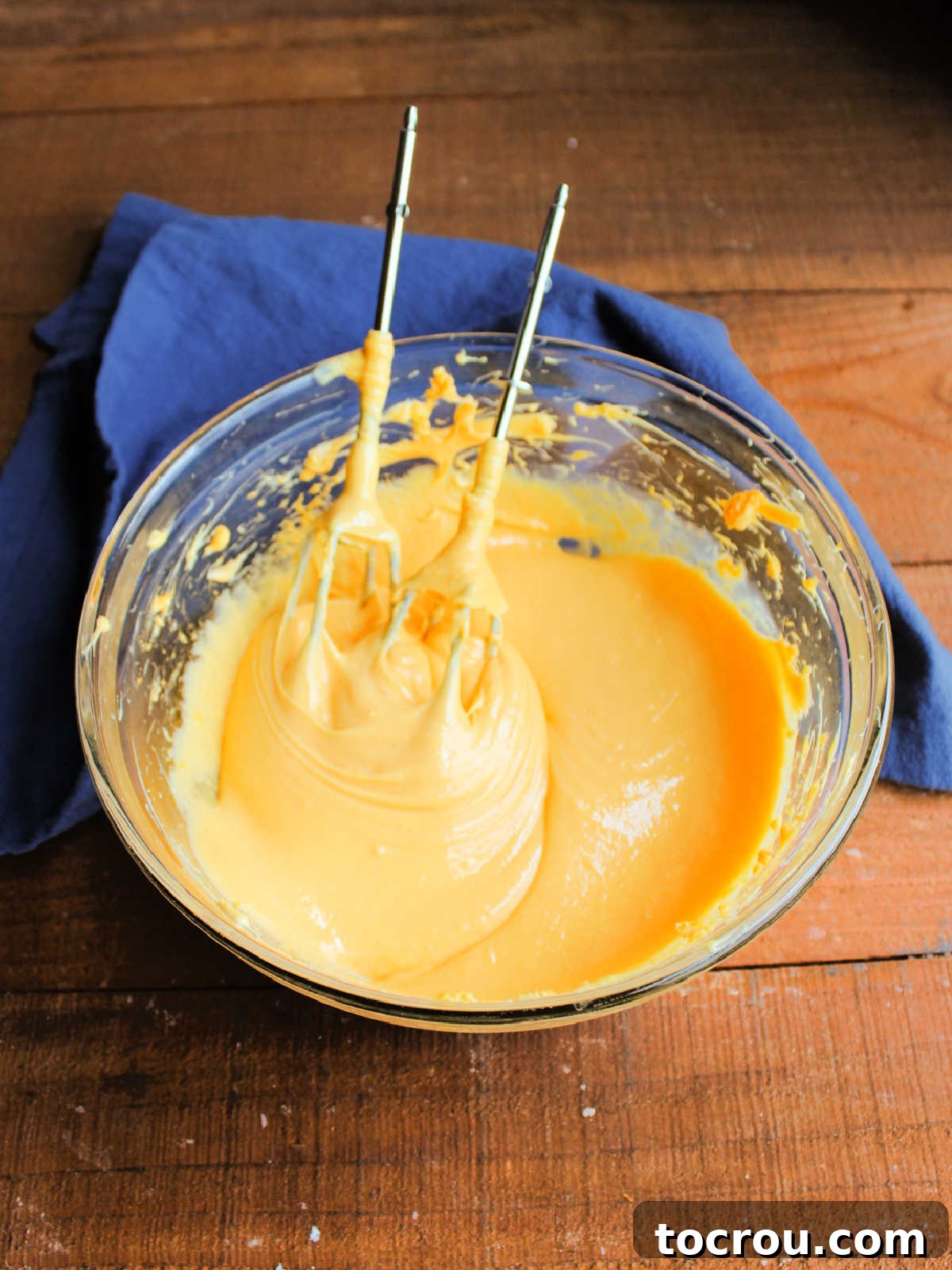 Golden Tang Delicacy 4 Smooth orange filling in mixing bowl after the condensed milk has been mixed into the cream cheese and Tang mixture.