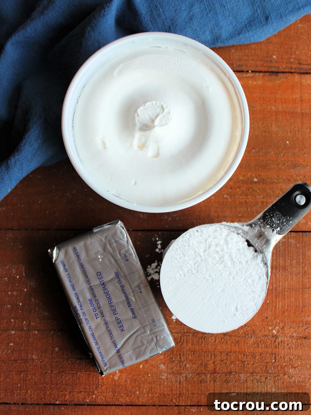 Ingredients including cream cheese, powdered sugar, and Cool Whip for base of pecan pie dip.