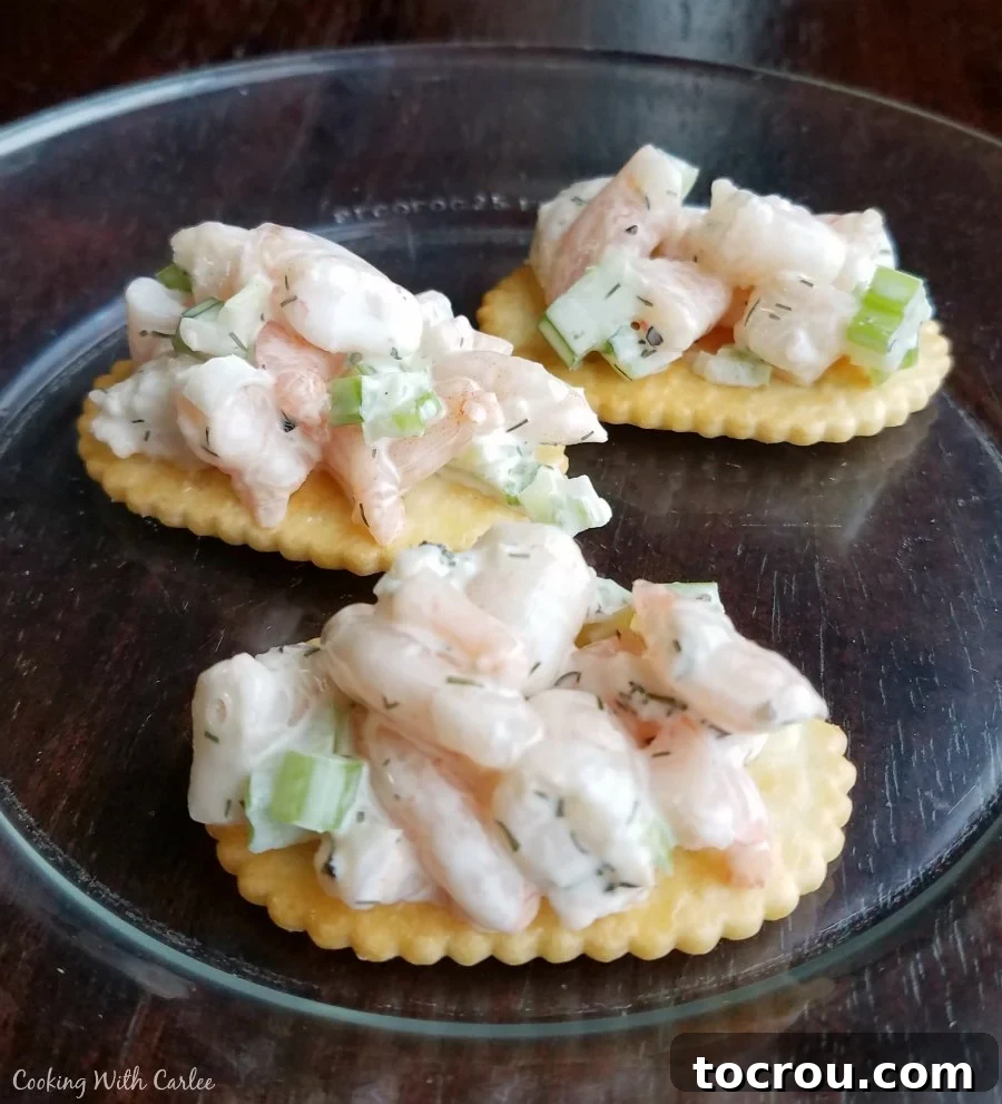 Savory Shrimp Profiterole Bites 4 shrimp salad on crackers.