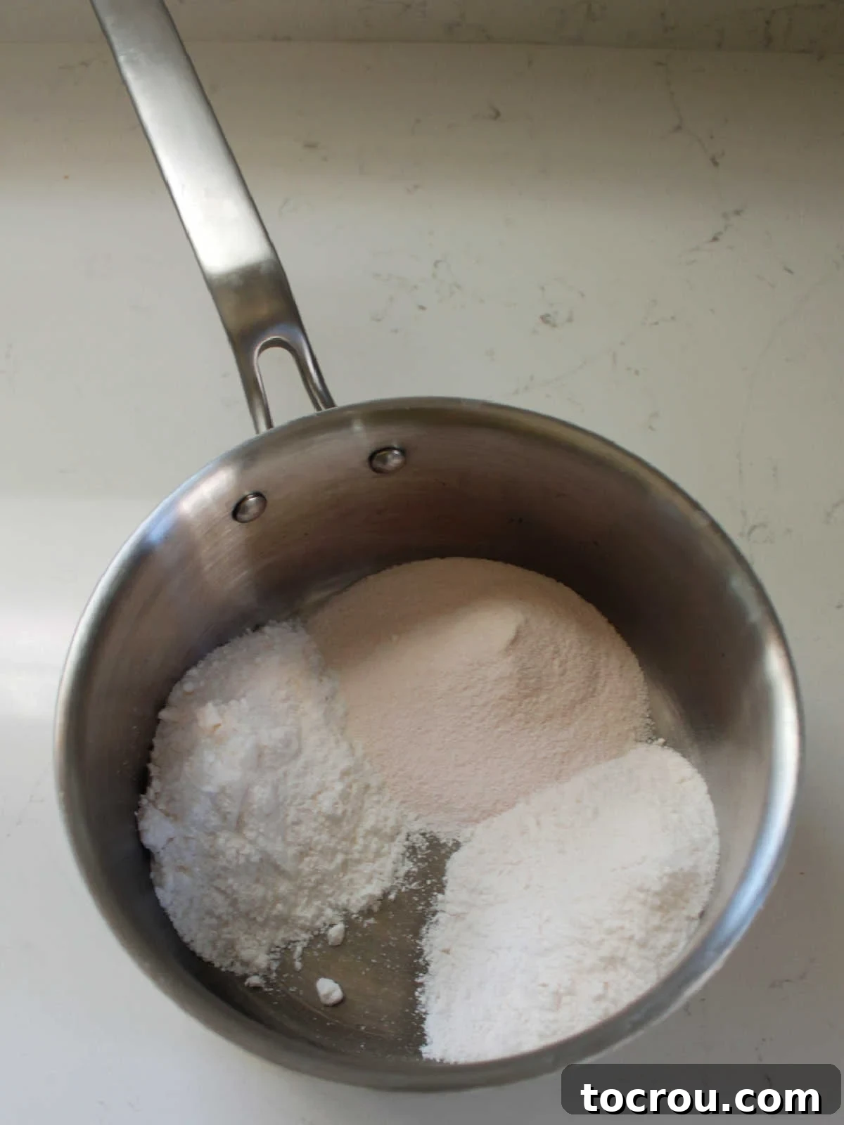 Dry ingredients: orange jello powder, cook and serve vanilla pudding mix, and tapioca pudding mix in saucepan. 