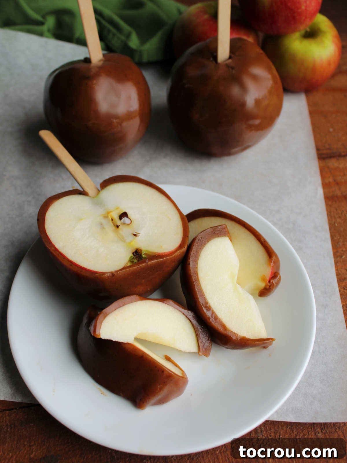 Sliced caramel apple with thick layer of homemade caramel on the outside and crisp apple inside. 
