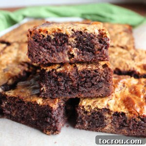 Brownie mix brownies with caramelized condensed milk swirl cut into pieces and stacked on top of each other.