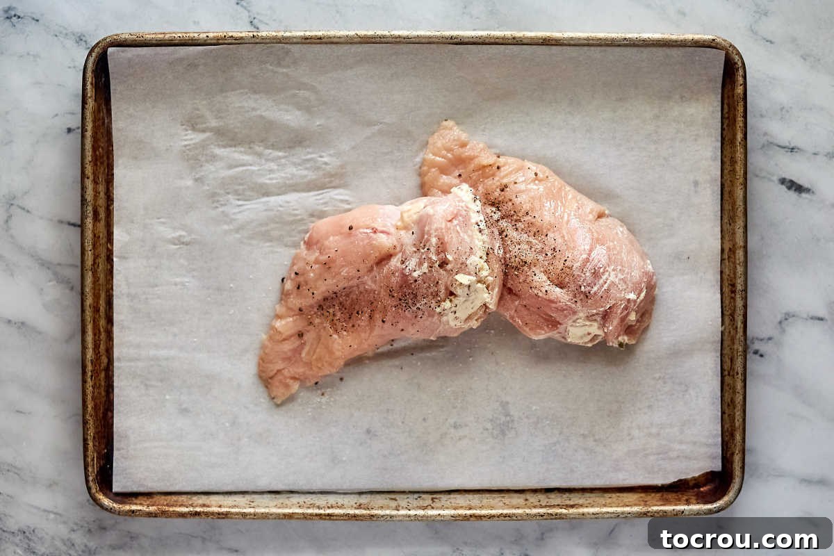 Creamy Jalapeno Popper Chicken 5 Chicken breasts stuffed with cream cheese and jalapeno filling, ready to be cooked.