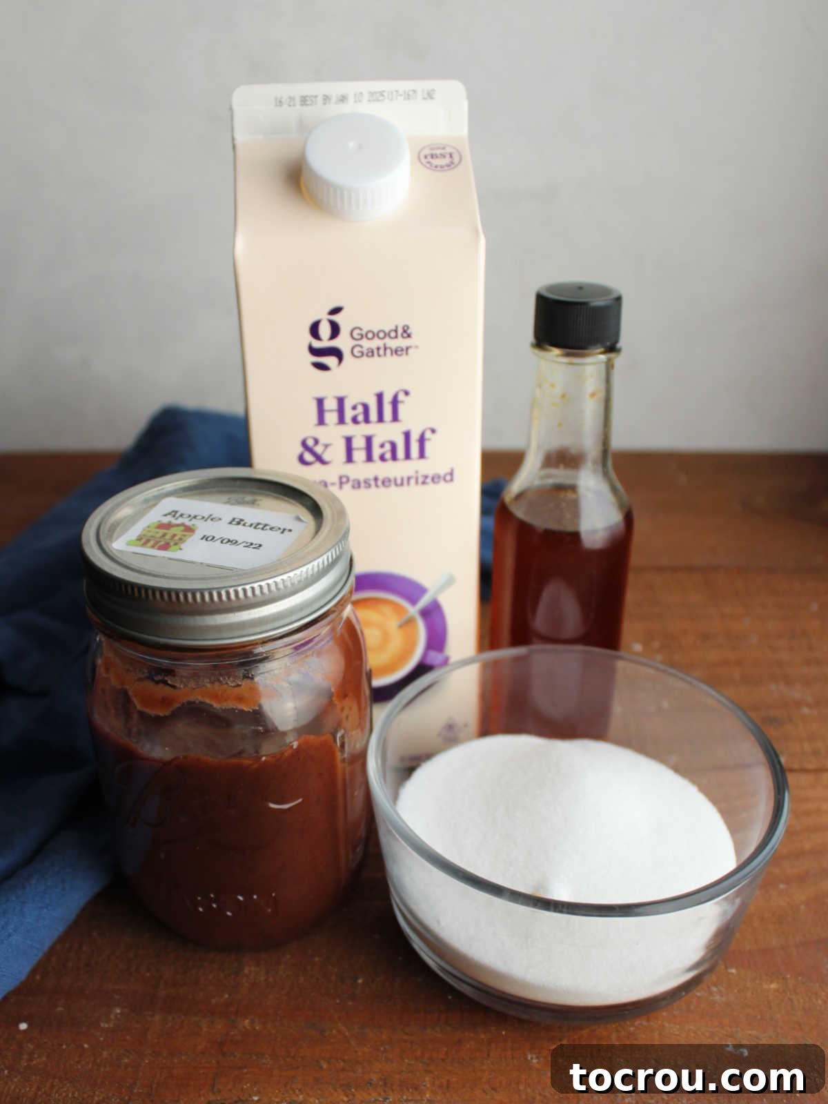 Ingredients including half and half, apple butter, vanilla extract, and sugar ready to be made into apple butter ice cream.