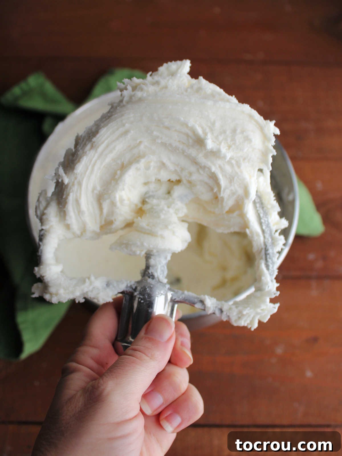 Creamy Dream Mints 3 Thick cream cheese mint mixture on mixer paddle, ready to be colored.