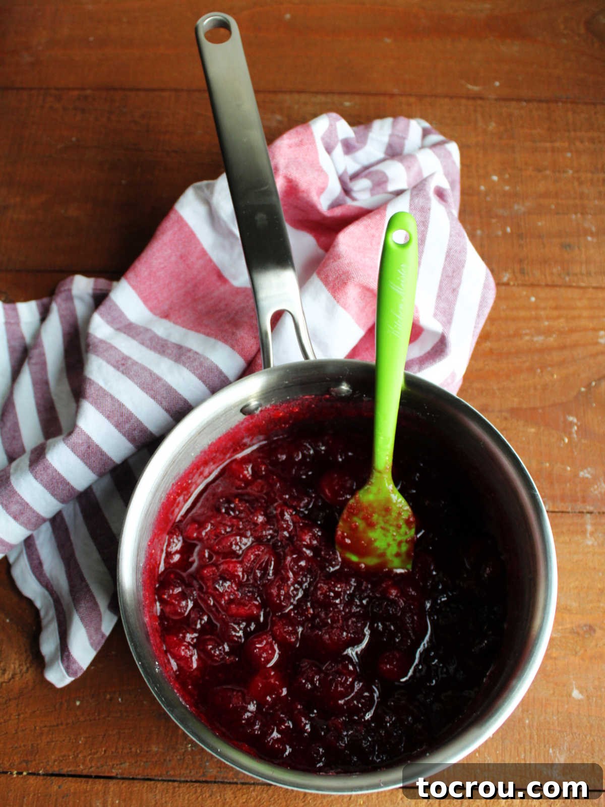 Crimson Cranberry Chill 4 Saucepan with cooked cranberry sauce showing popped berries and thickened texture, ready to be processed.