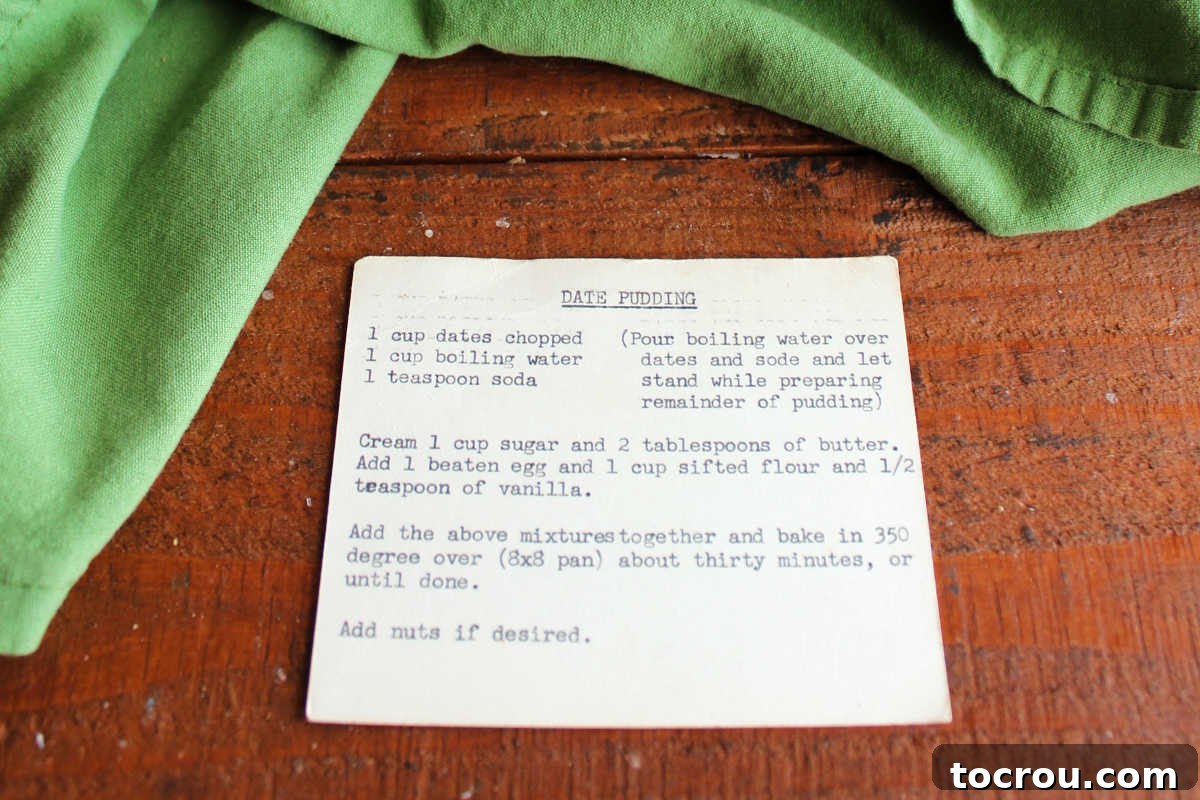 Yellowed index card with date pudding recipe typed out on a typewriter. 