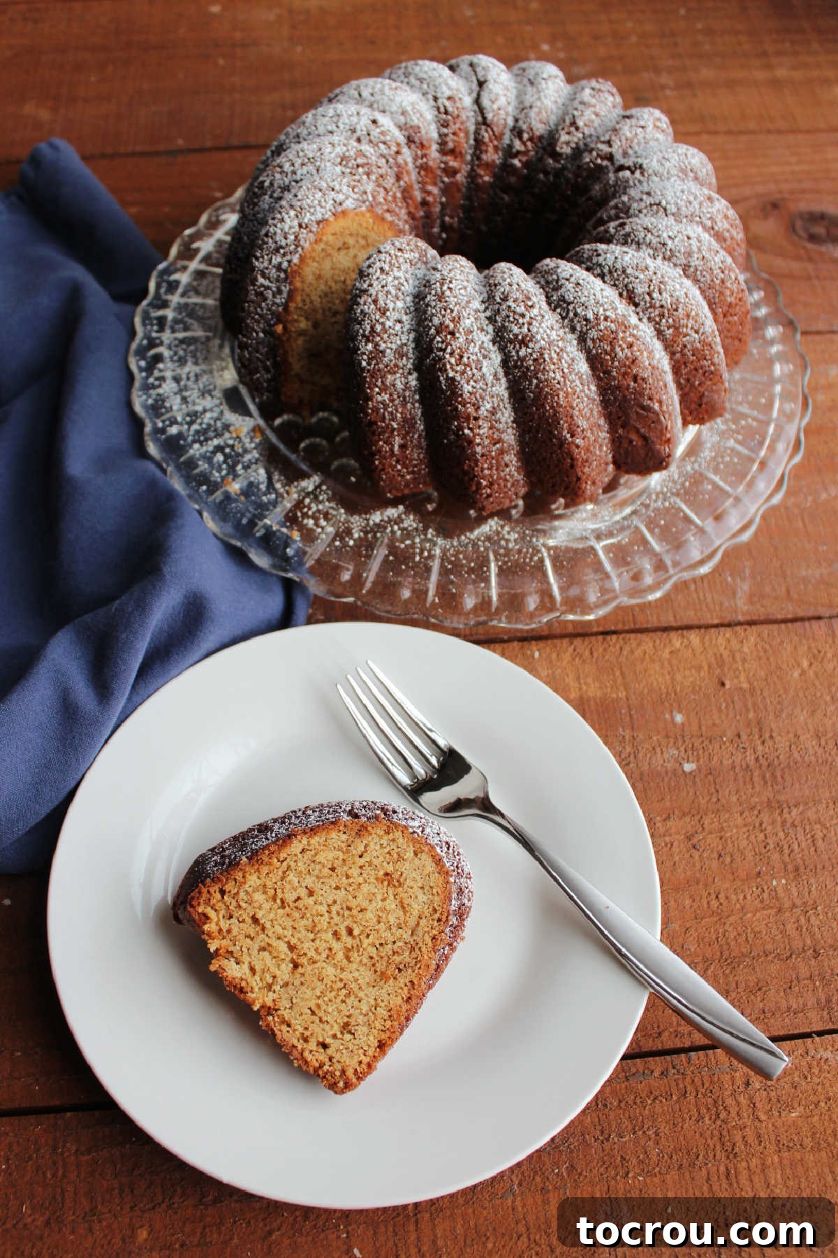 Pound Cake Ready to Eat A delectable piece of brown sugar Bundt cake artfully arranged on a plate with a fork, poised for enjoyment.