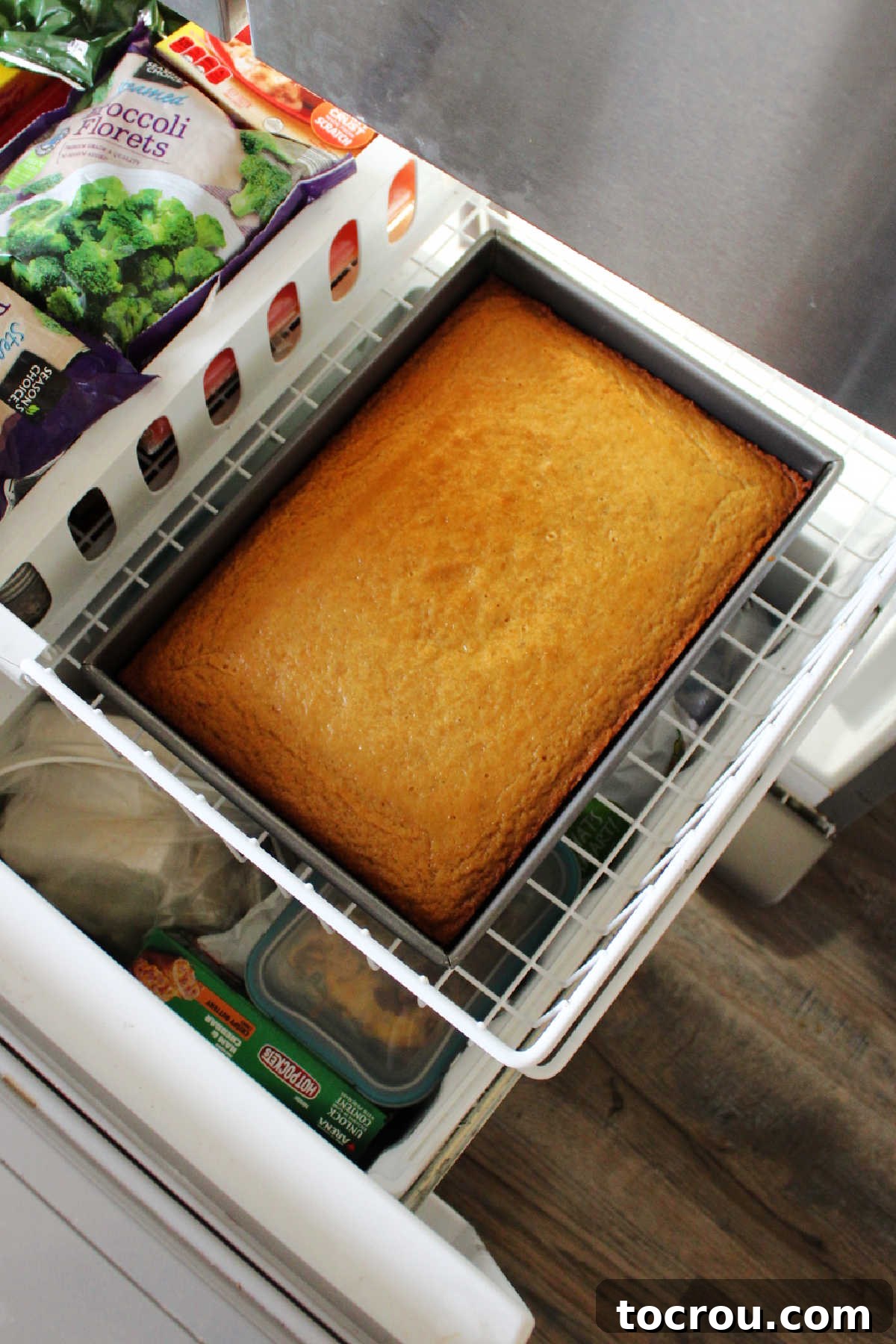 Golden Banana Cake Crowned with Brown Sugar Glaze 7 Baked banana cake going into the freezer to chill.