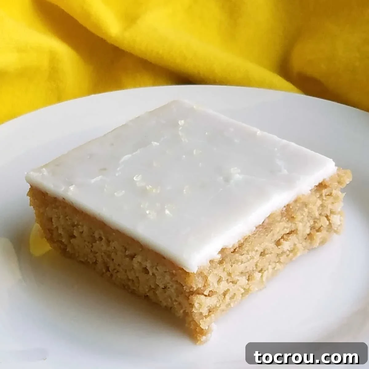 The classic tea and lemonade combination of the Arnold Palmer is now available in Texas sheet cake form. Perfect for BBQs, potlucks or any summertime party! Sweet tea sheet cake topped with lemon icing for an Arnold Palmer cake.