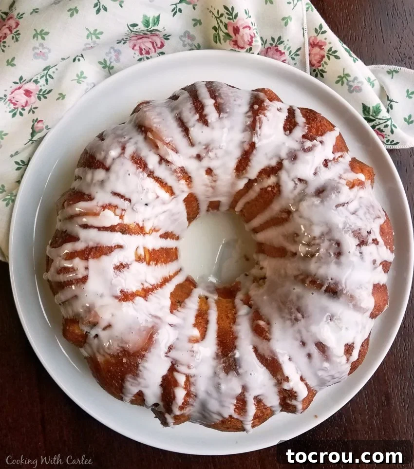 Whole glazed babka on plate, ready to serve.