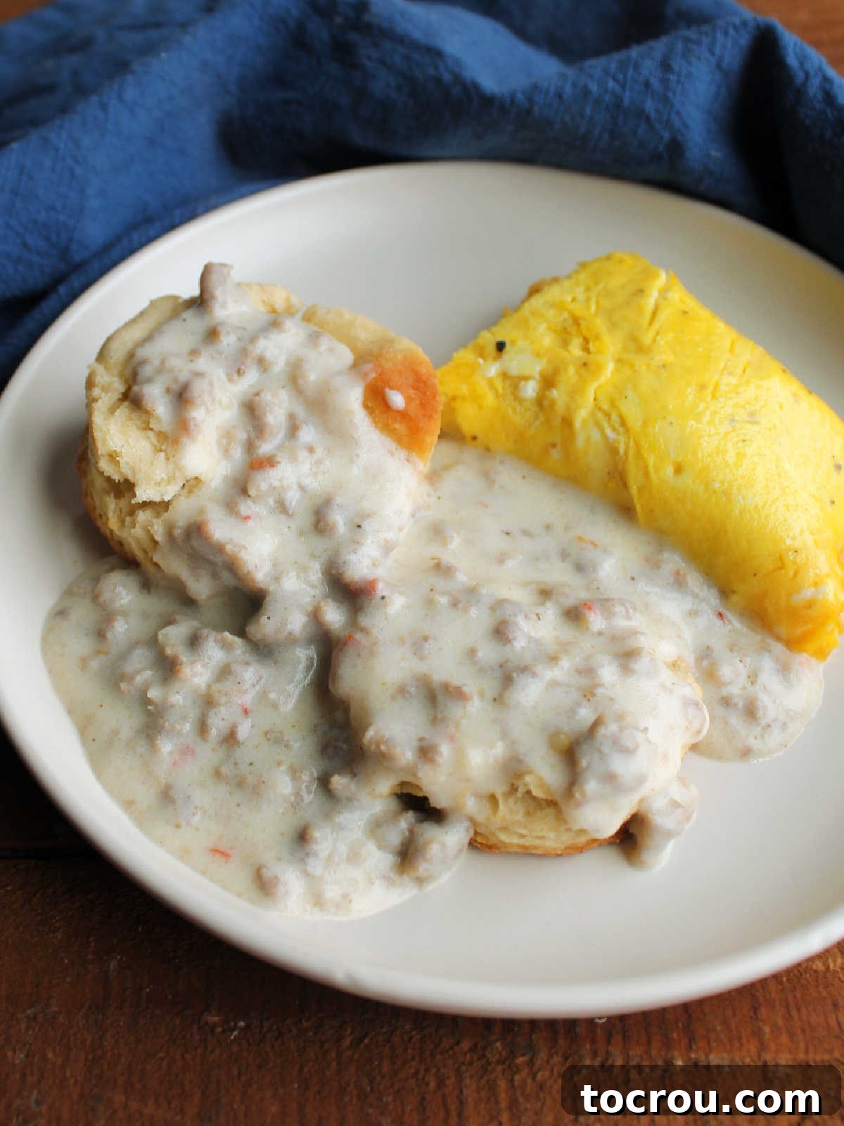 Biscuits topped with homemade sausage gravy served with a French omelet. A classic hearty breakfast.