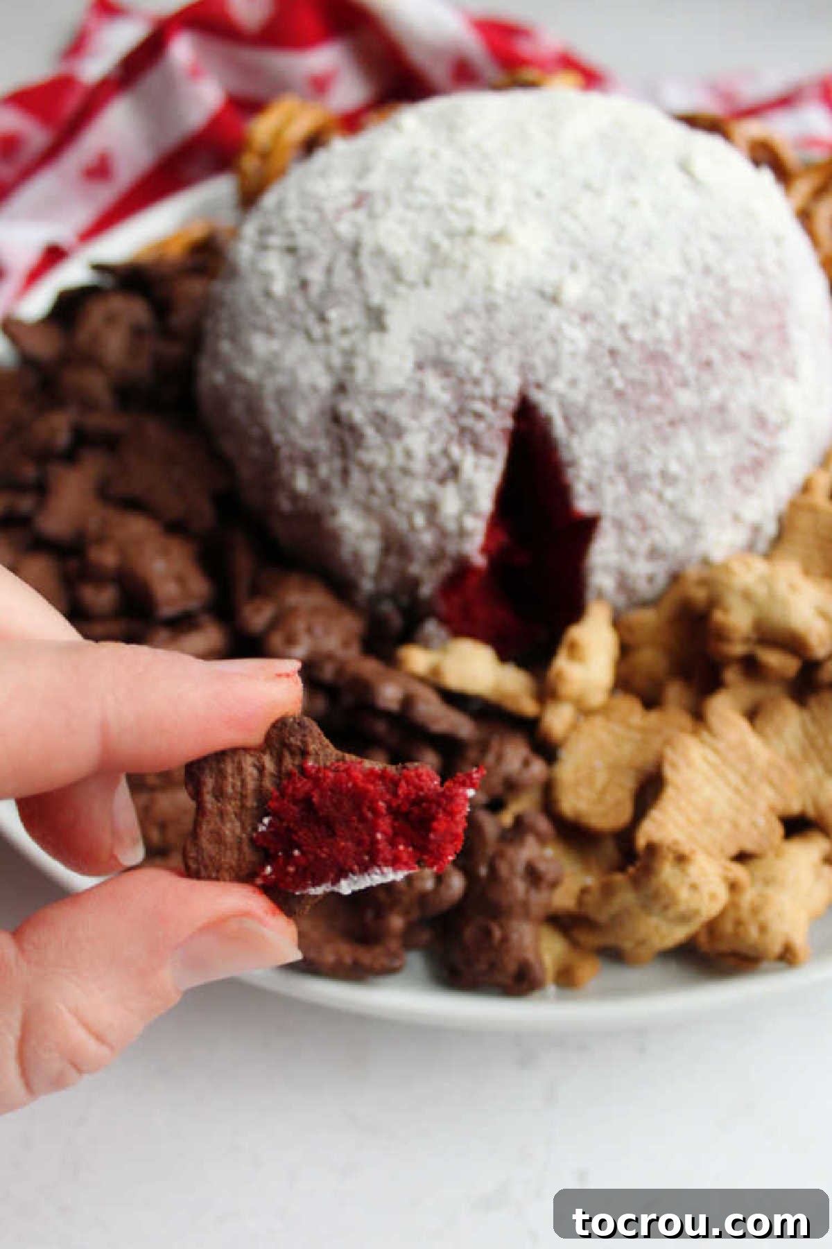 Red Velvet Cheesecake Ball 5 chocolate teddy graham with red velvet cheese ball on it.