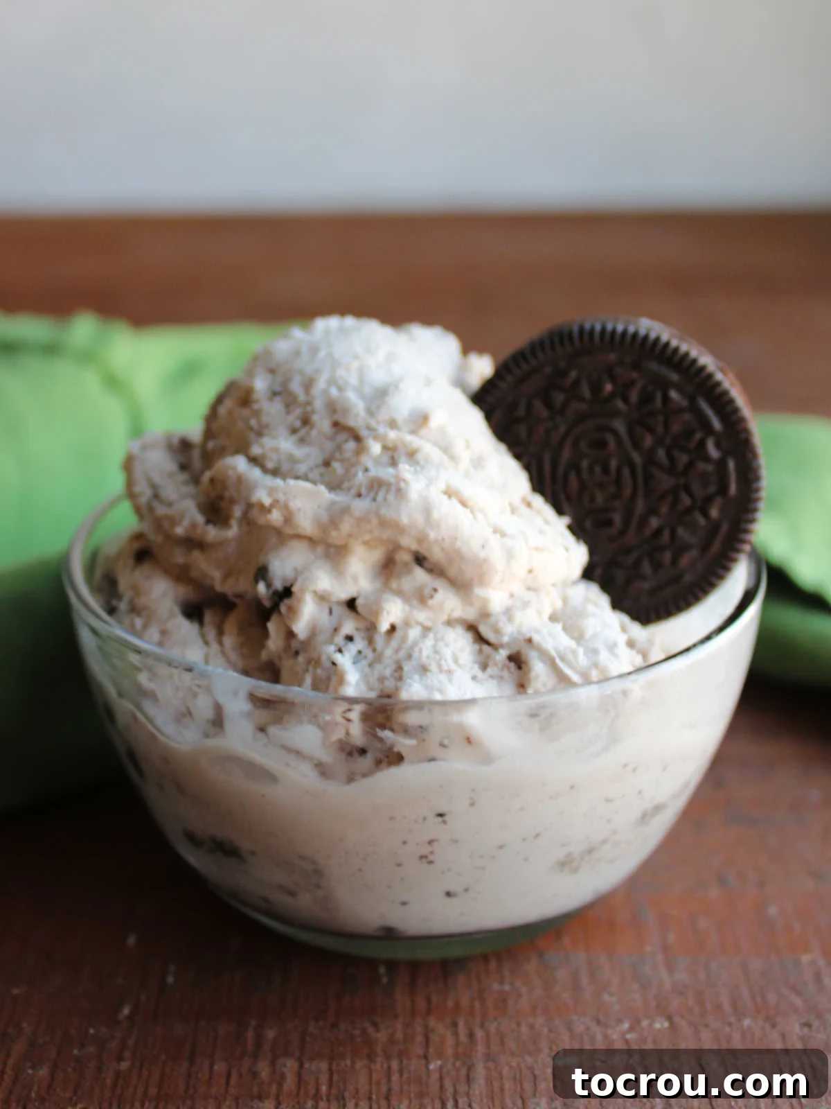 Vanilla Bean Dream with Chocolate Swirls 6 Small glass bowl of homemade cookies and cream ice cream without eggs served with a whole Oreo.