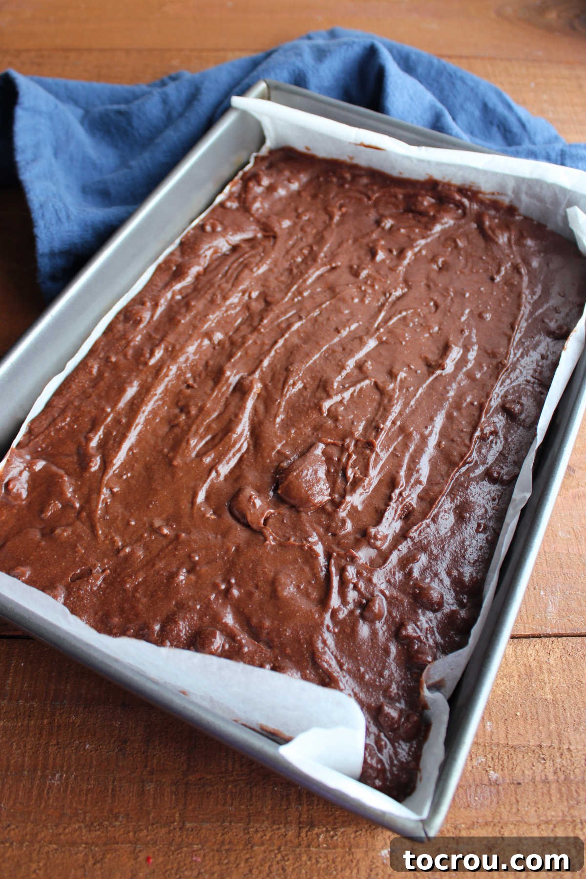 Sourdough brownie batter in 9x13-inch pan, ready to go in the oven. 