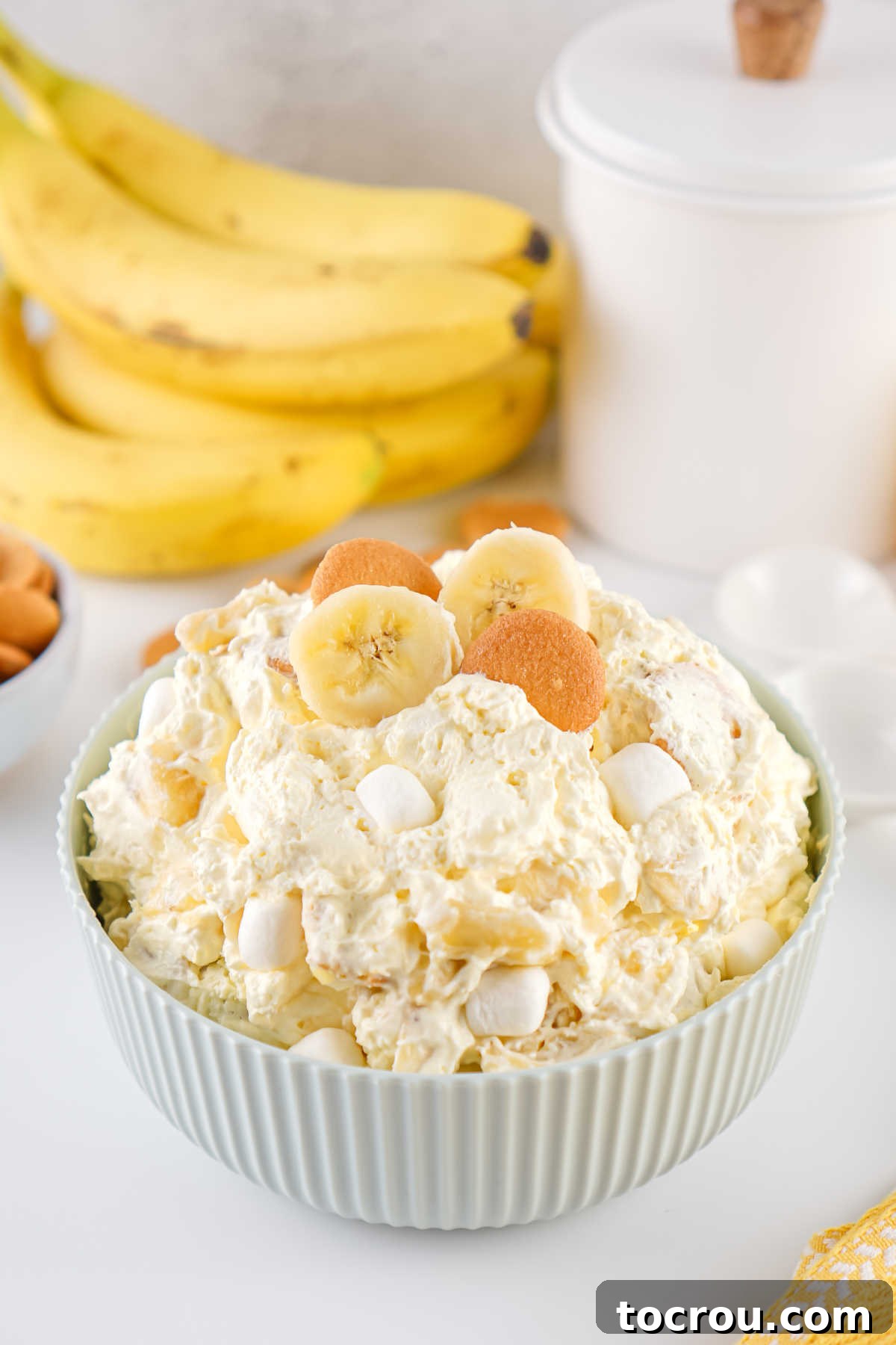 Serving bowl filled with banana pudding fluff salad, ready to be served. 