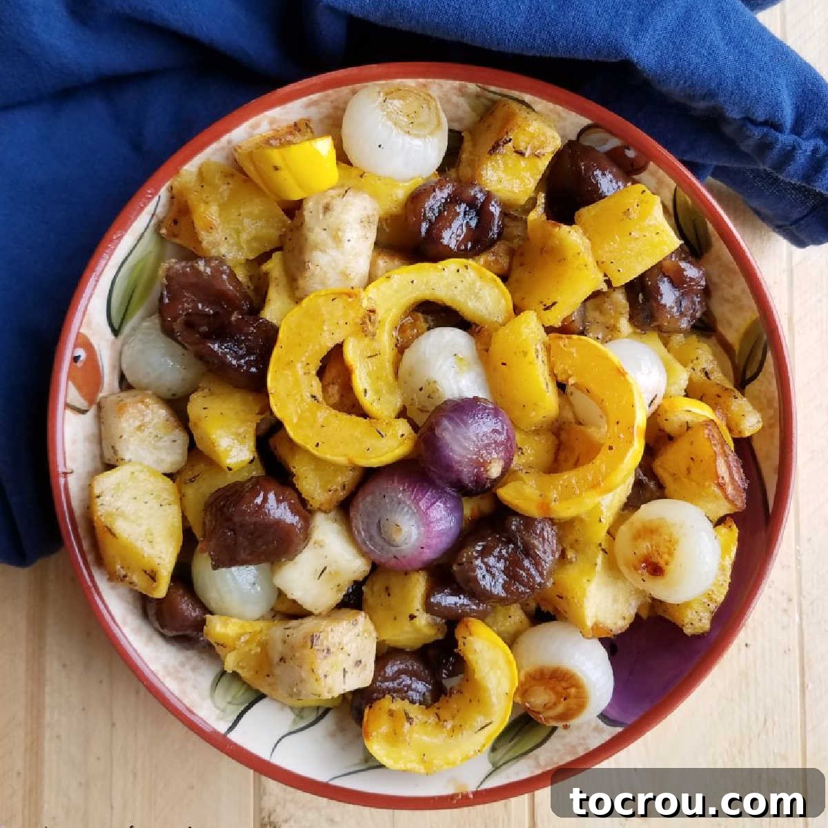 bowl of roasted fall vegetables with chestnuts in a maple glaze ready to serve.