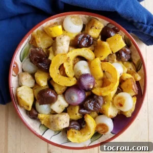 bowl of roasted fall vegetables with chestnuts in a maple glaze ready to serve.